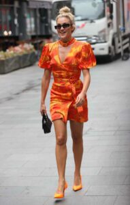 Ashley Roberts in an Orange Floral Dress