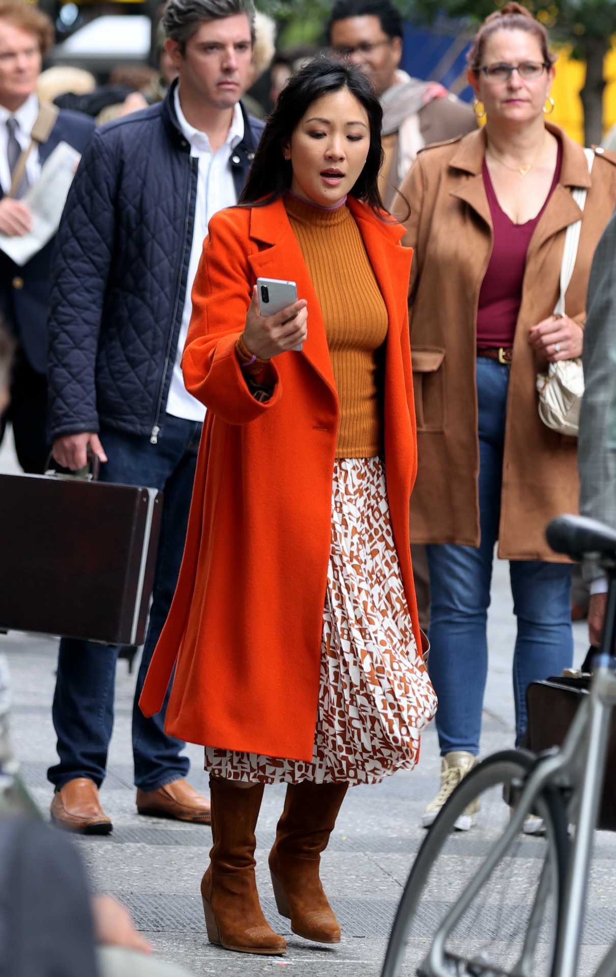 Constance Wu in an Orange Coat