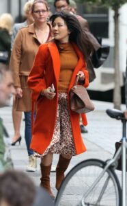 Constance Wu in an Orange Coat