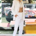 Frida Aasen in a White Suit Arrives at the 78th Venice International Film Festival in Venice 09/08/2021