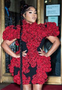 Lil Kim in a Red and Black Floral Dress