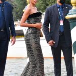 Tina Kunakey in a Black Snakeskin Print Dress Arrives at the 78th Venice International Film Festival in Venice 09/03/2021