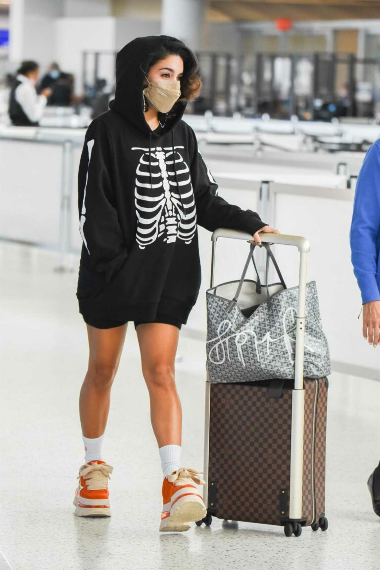 Vanessa Hudgens in a Black Skeleton Print Hoodie Arrives at JFK Airport