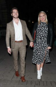 Amy Walsh in a Black Patterned Dress
