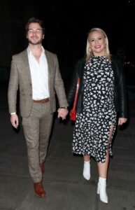 Amy Walsh in a Black Patterned Dress