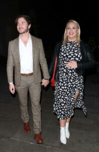 Amy Walsh in a Black Patterned Dress