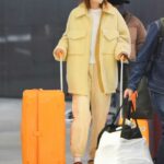 Gigi Hadid in a Yellow Outfit Arrives to JFK Airport in New York City 09/30/2021