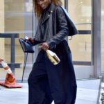 Issa Rae in a Black Leather Jacket Heads to an Office Building in New York 10/20/2021