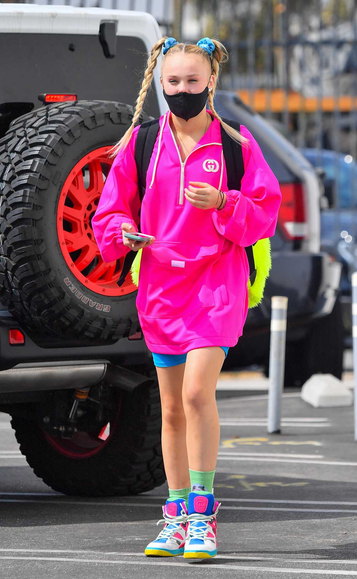 JoJo Siwa in a Neon Pink Hoodie