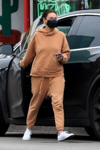 Mila Kunis in an Orange Sweatsuit
