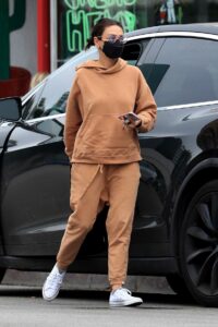 Mila Kunis in an Orange Sweatsuit