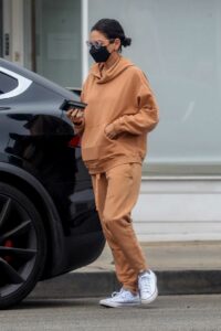 Mila Kunis in an Orange Sweatsuit