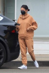 Mila Kunis in an Orange Sweatsuit