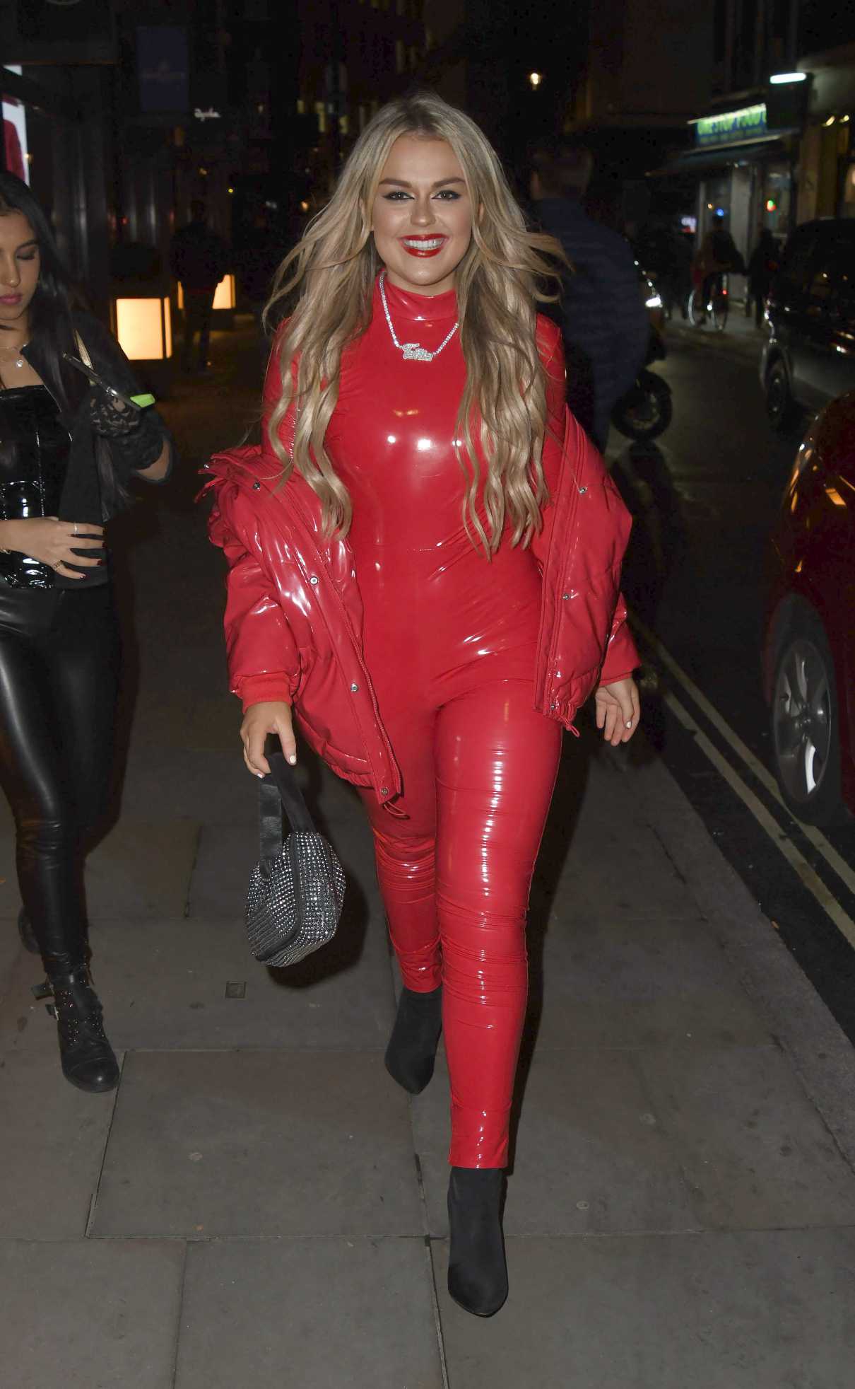 Tallia Storm in a Red Ensemble