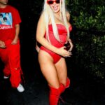 Tana Mongeau in a Revealing Red Costume Leaves YG’s Halloween Party in Hollywood 10/27/2021