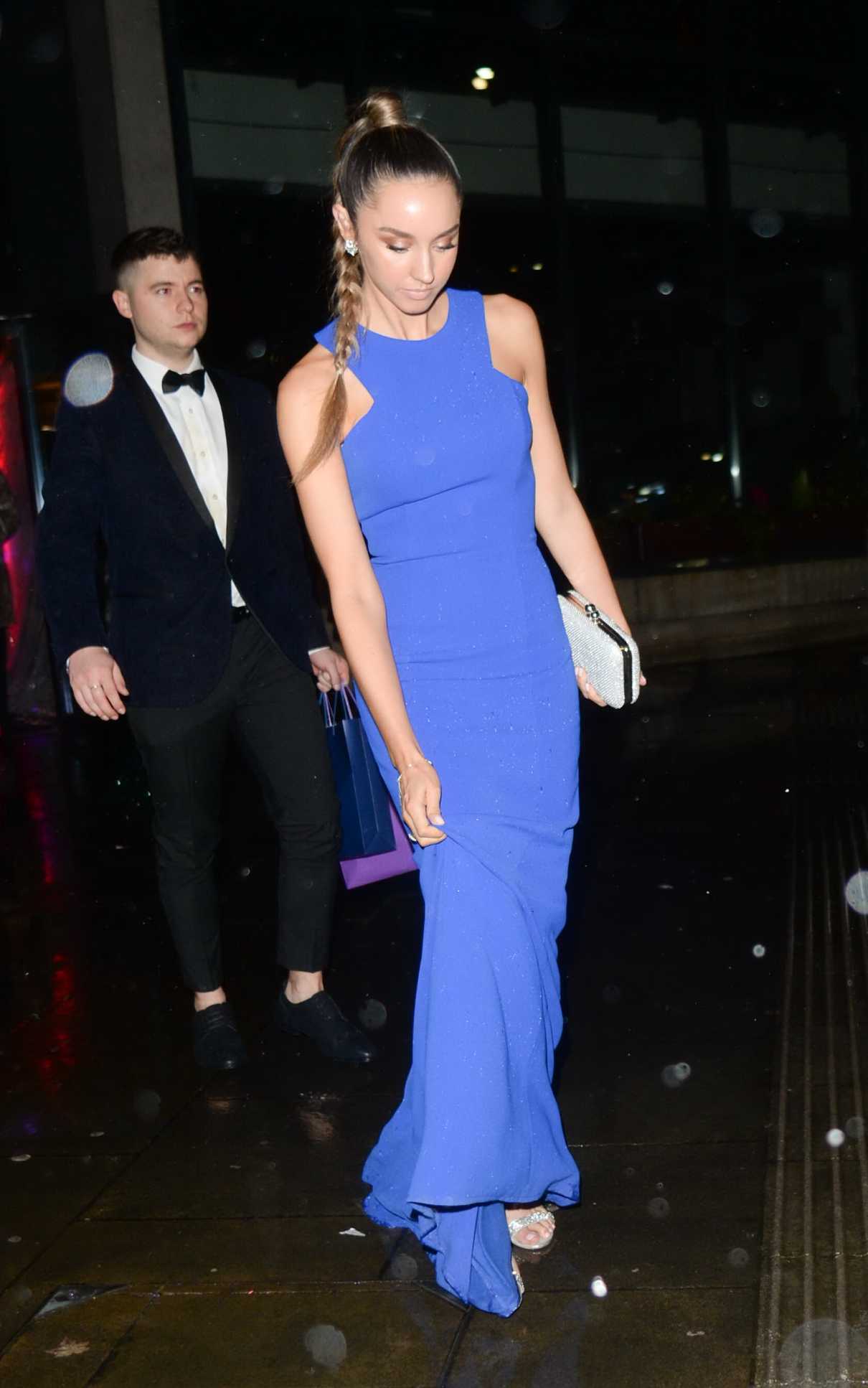 Emily Andre in a Blue Dress