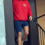 Harry Styles in a Red Hoodie Leaves His Workout at a Gym in Studio City 11/18/2021