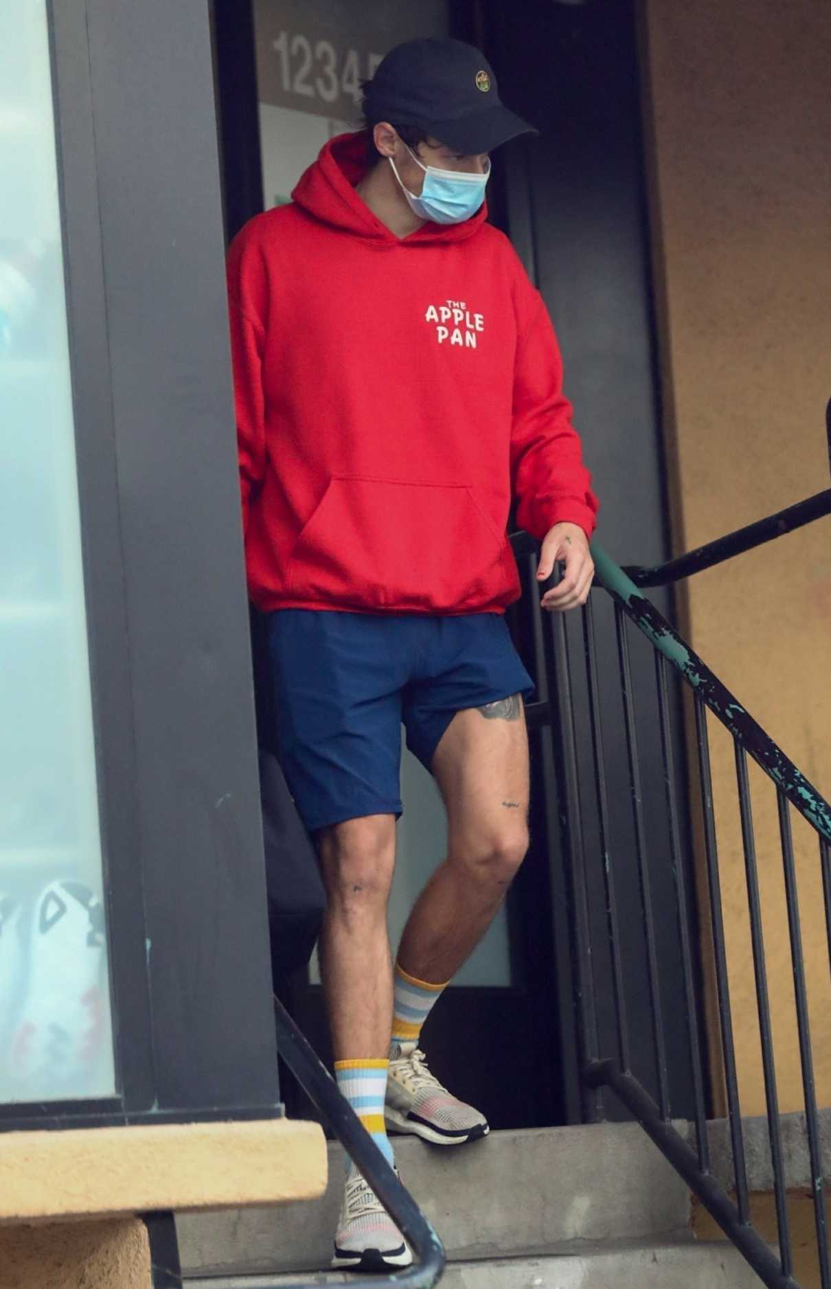 Harry Styles in a Red Hoodie