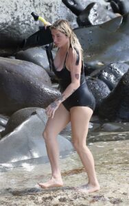 Kesha in a Black Swimsuit