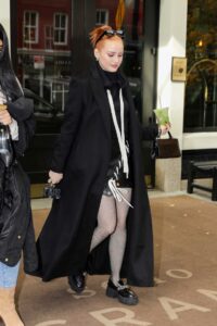 Madelaine Petsch in a Black Coat