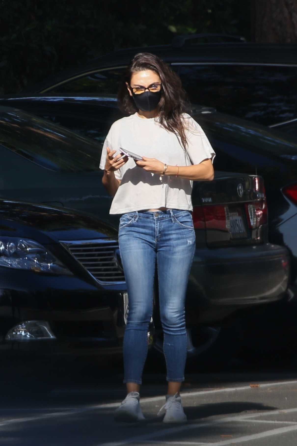 Mila Kunis in a Black Protective Mask