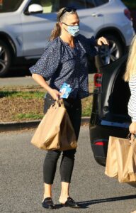 Molly Sims in a Blue Floral Blouse