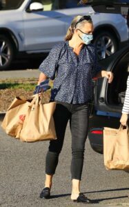Molly Sims in a Blue Floral Blouse