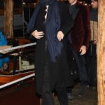 Monica Bellucci in a Black Coat Arrives at the Carlo Goldoni Theater Accompanied by Director Tom Volf in Venice 11/25/2021