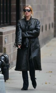 Ashley Benson in a Black Sheepskin Coat