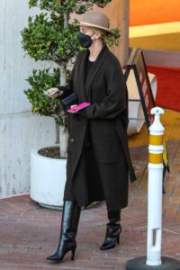 Charlize Theron in a Black Coat