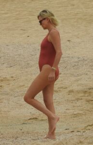 Charlize Theron in a Burgundy Color Swimsuit