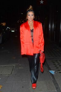 Frankie Sims in a Red Blazer