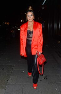 Frankie Sims in a Red Blazer