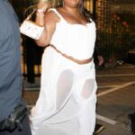 Lizzo in a White Outfit Exits Kanye West and Drake’s Free Larry Hoover Benefit Concert at the LA Memorial Coliseum in Los Angeles 12/09/2021