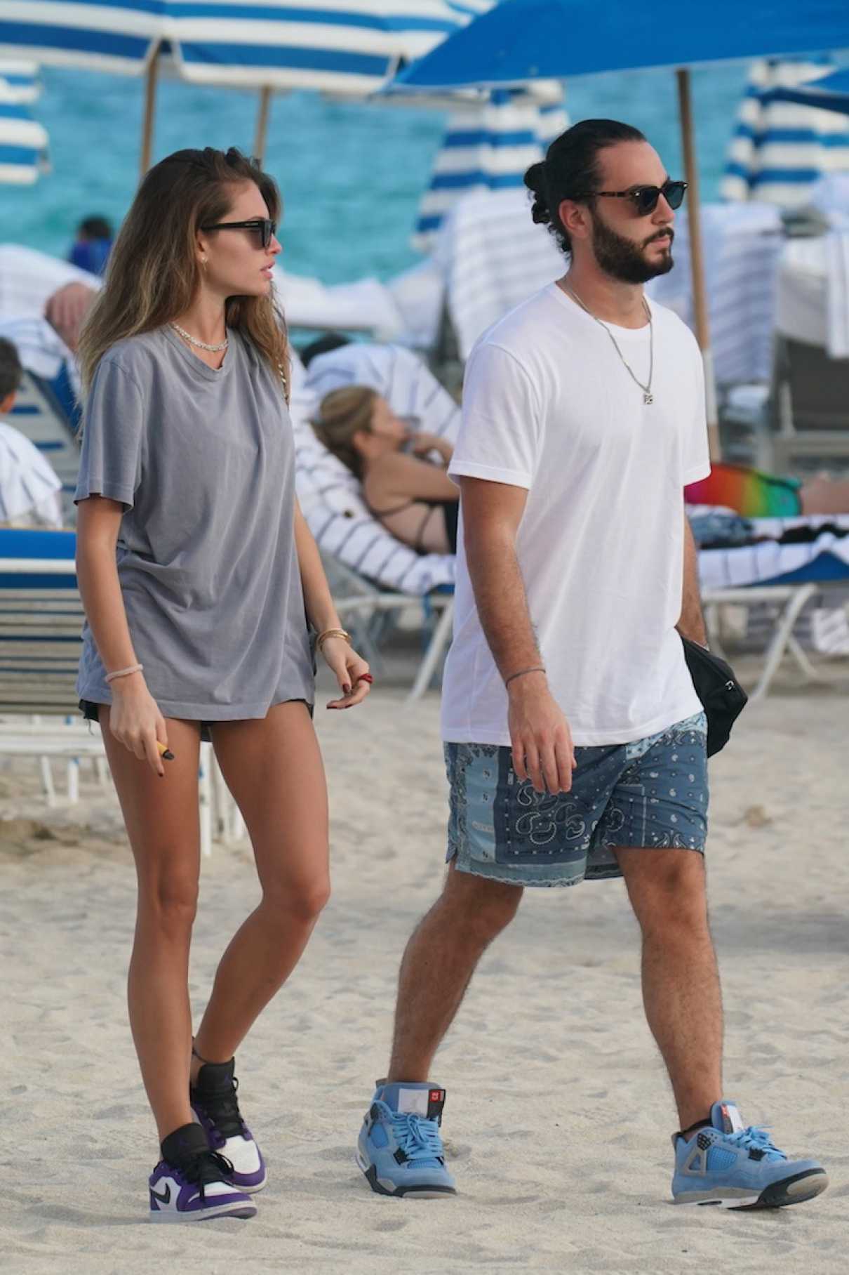 Thylane Blondeau in a Grey Tee Was Spotted on the Beach in Miami 12/27