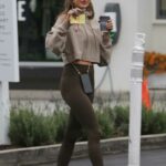 Alessandra Ambrosio in a Tan Cropped Hoodie Gets Her Coffee in Brentwood 01/15/2022