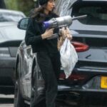 Christine Lampard in a Black Beanie Hat Was Seen with a Dyson Cordless Hoover Out in London 01/27/2022