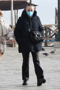 Dakota Fanning in a Black Puffer Jacket