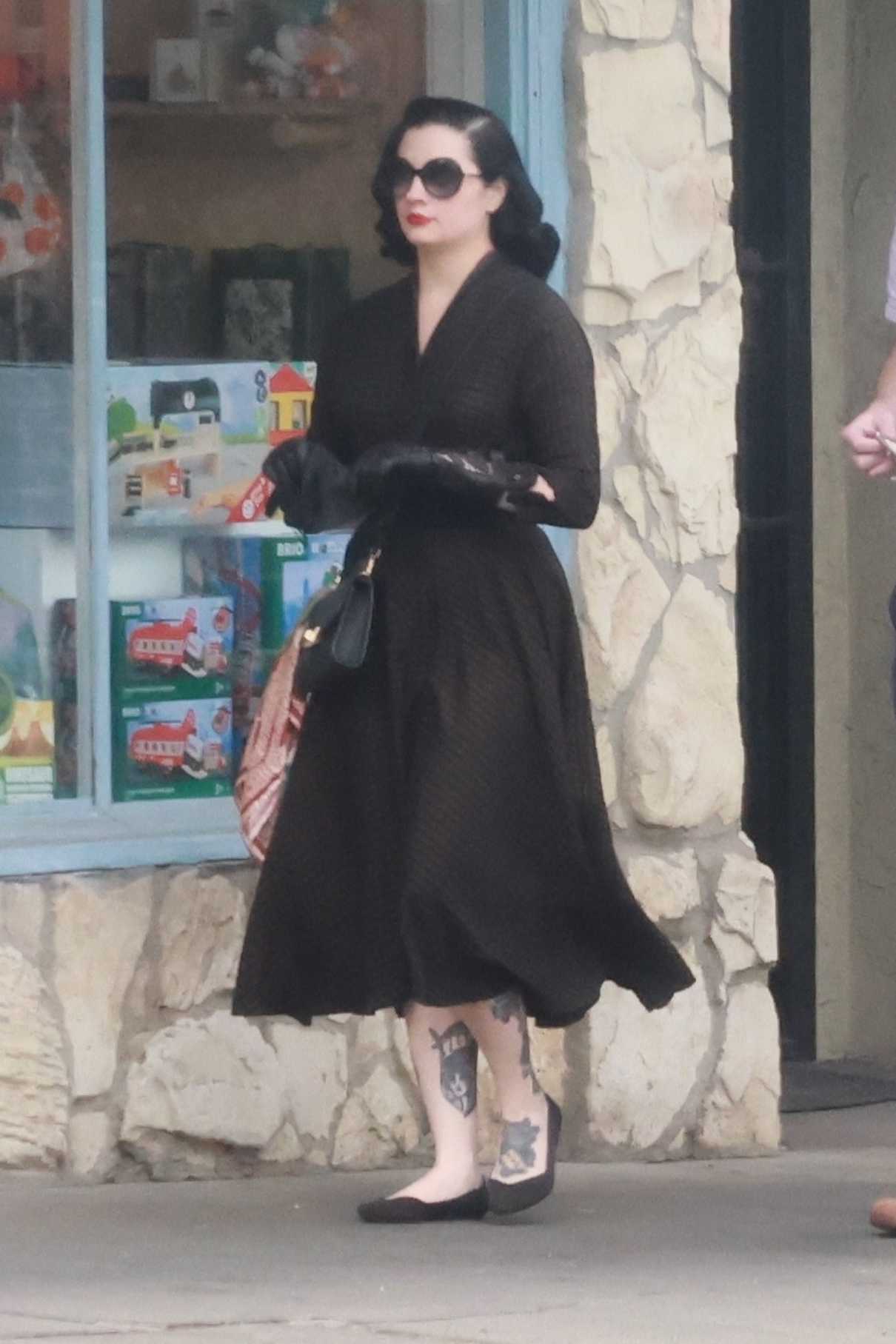 Dita Von Teese in a Black Dress