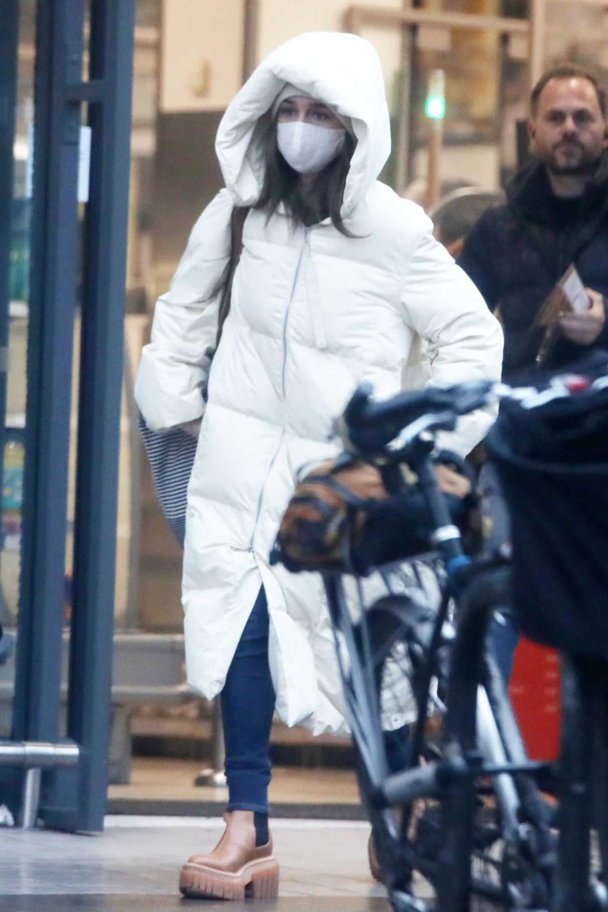 Emilia Clarke in a White Puffer Coat
