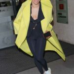 Karen Hauer in a Yellow Coat Was Seen After Presenting Strictly Fitness on BBC Morning Live TV in London 01/25/2022