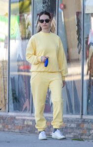 Lily James in a Yellow Sweatsuit