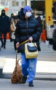 Meadow Walker in a Black Puffer Jacket