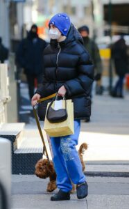 Meadow Walker in a Black Puffer Jacket