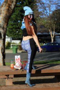 Phoebe Price in a Blue Beanie Hat