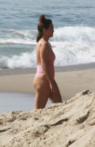 Chrissy Teigen in a Pink Swimsuit