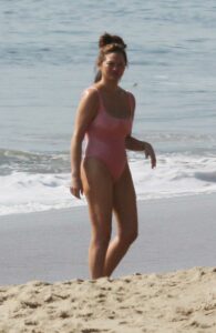 Chrissy Teigen in a Pink Swimsuit