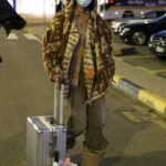 Iris Law in an Olive Pants Arrives with Her Luggage in Milan 02/22/2022