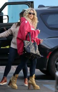 Jessica Simpson in a Red Ripped Hoodie