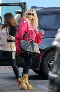 Jessica Simpson in a Red Ripped Hoodie